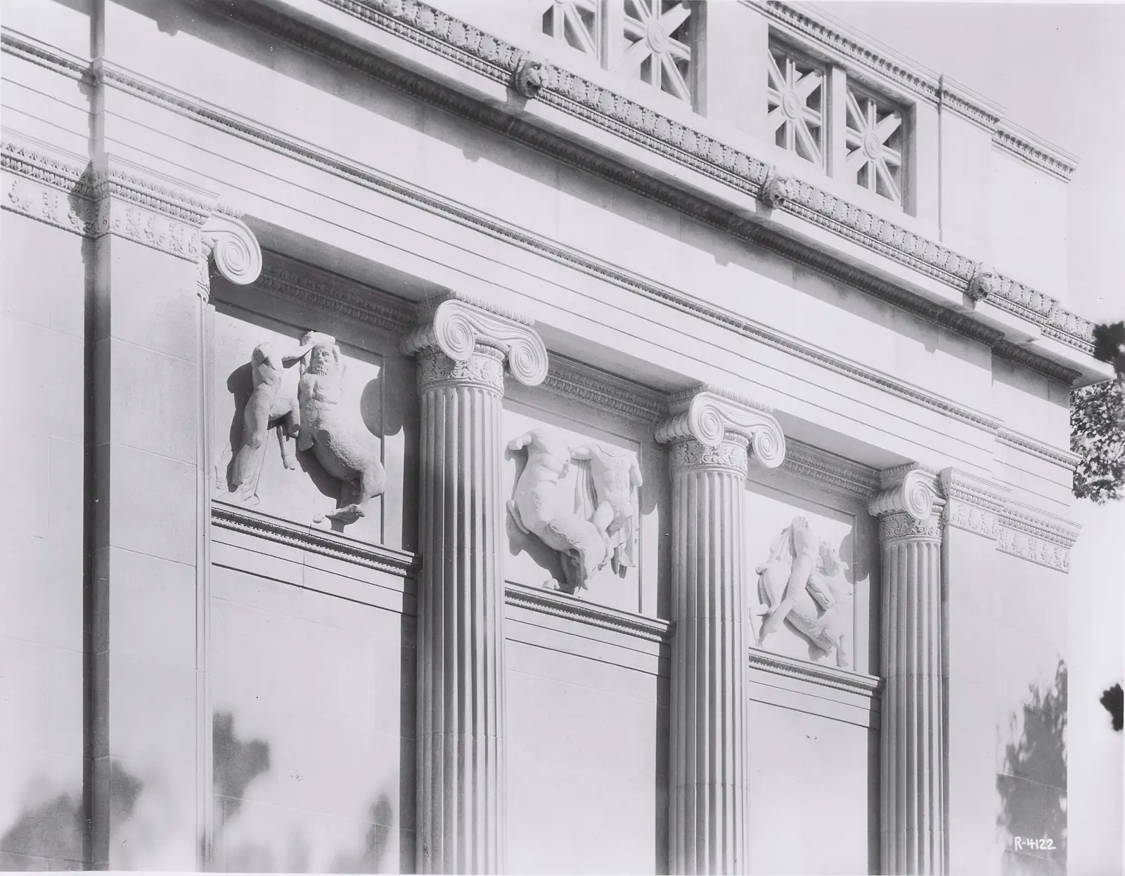 Equestrian relief panels installed between the columns